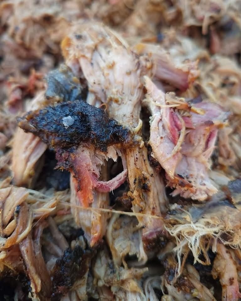 Hand-pulled smoked pork shoulder piled high with caramelized bark