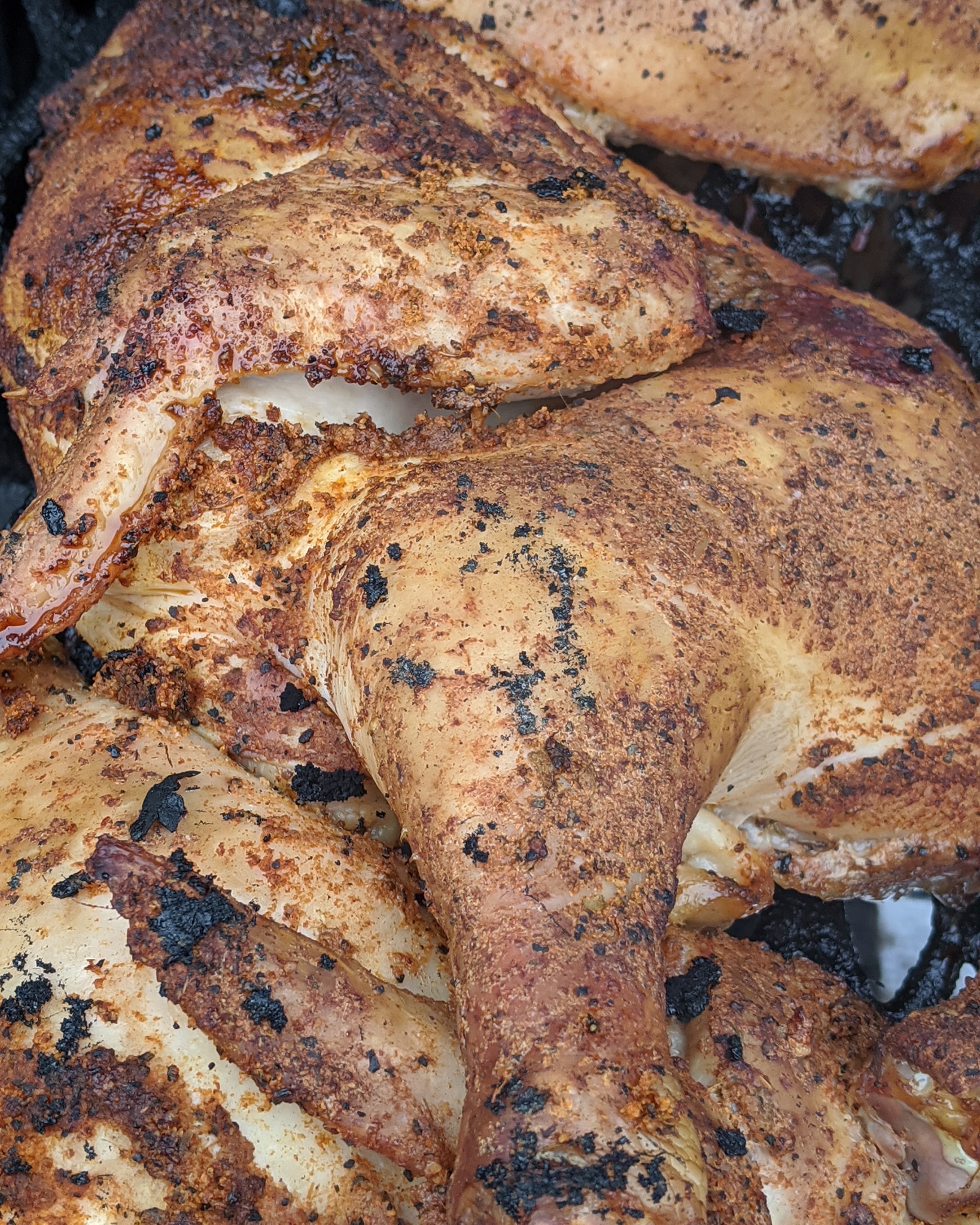 Smoked chicken with seasoned skin and juicy sliced meat